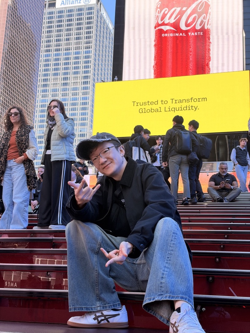 Justin posing on the Times Square steps